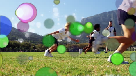 moving spots of coloured light with children running