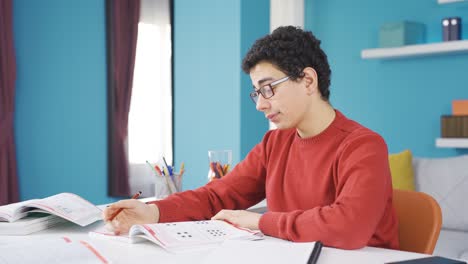 Tired-of-studying,-the-child-falls-asleep-and-tries-to-collect-himself-and-study.