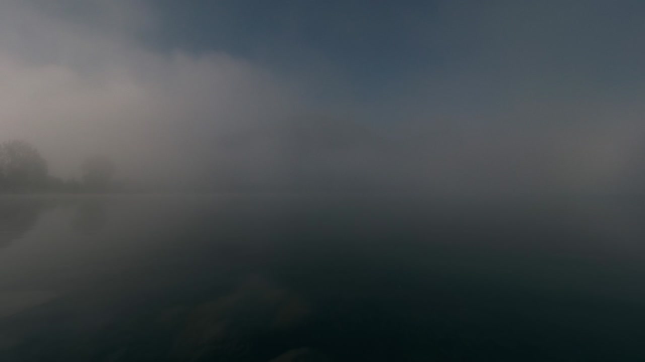 Early morning time lapse mountains and lake