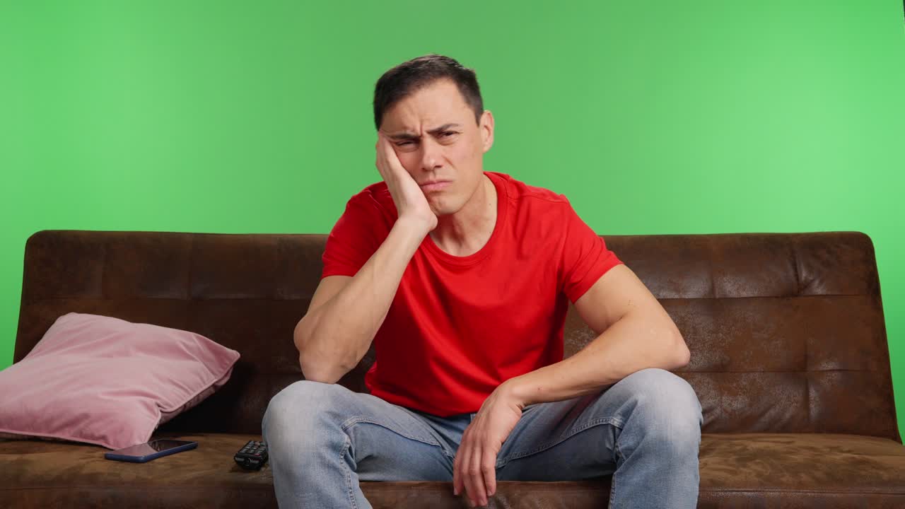 Man starts watching a movie but falls asleep