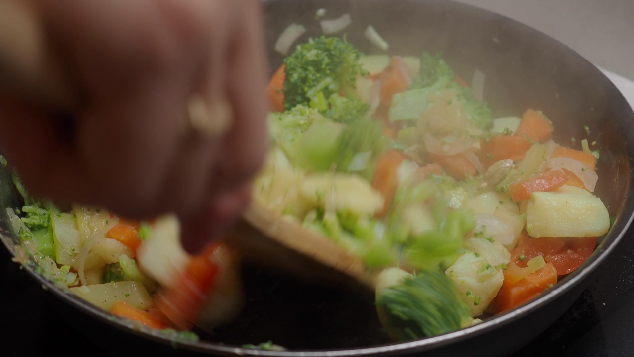 Close-up of Fresh Chopped Vegetables Stir-Frying in a Pan