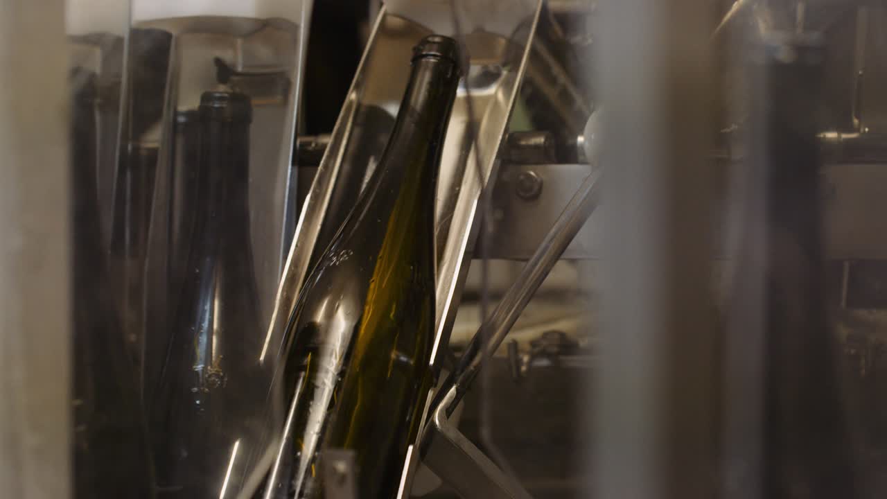 Machine cleaning wine bottles before they get filled; bottling process