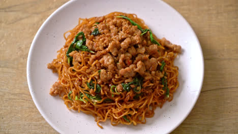 stir-fried instant noodles with thai basil and minced pork - asian food style