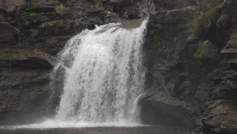 Slow-motion-tilting-shot-revealing-the-cascading-Falls-of-Falloch-in-Scotland