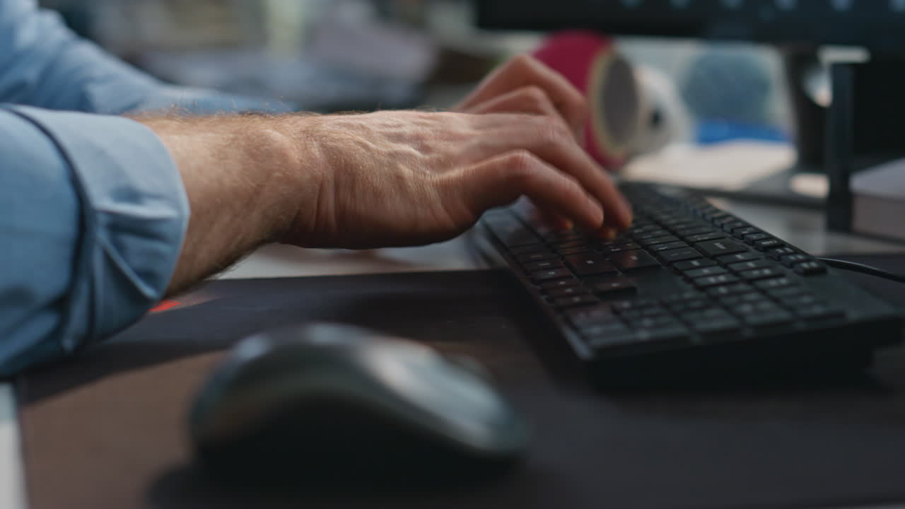 Guy fingers typing computer at corporate office closeup. Man pressing buttons