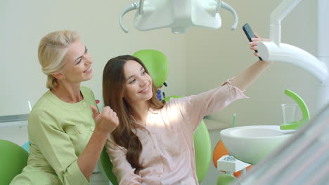 Happy-doctor-and-patient-taking-selfie-together