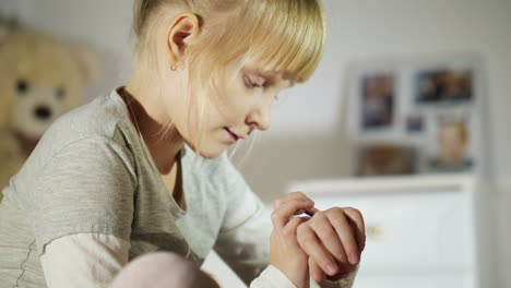 the child talks with the help of children's smart watches lying on the bed in my bedroom