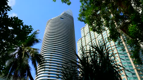 big glass building office tower in the city.