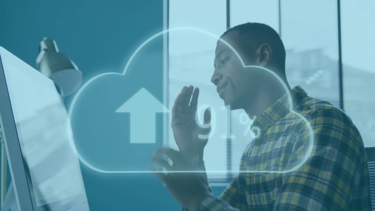 Animation of cloud and percents over biracial businessman working in office