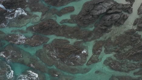 tide pools and reef of yakushima at tsukasaki, aerial bird's eye view