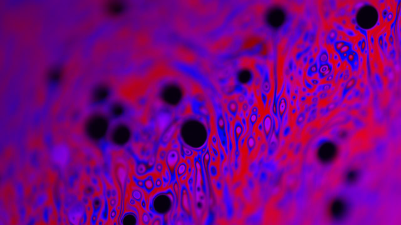 Pink and Purple-Colored Liquid from Soap's Surface: Macro Shot