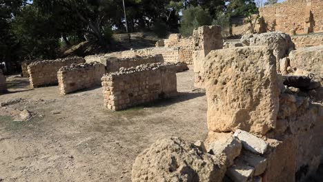 Ancient-Roman-ruins-of-Carthage-under-a-clear-sky-in-Tunisia,-hint-of-history-and-archeology