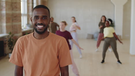 portrait of happy african american man in dance class