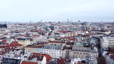 aerial flying backwards over buildings of vienna old town, austria