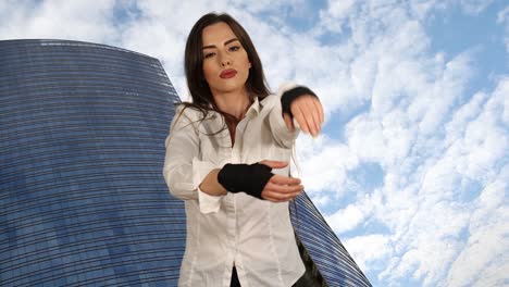 Young-woman-with-punching-wraps-stretching-arms-before-hard-working-day