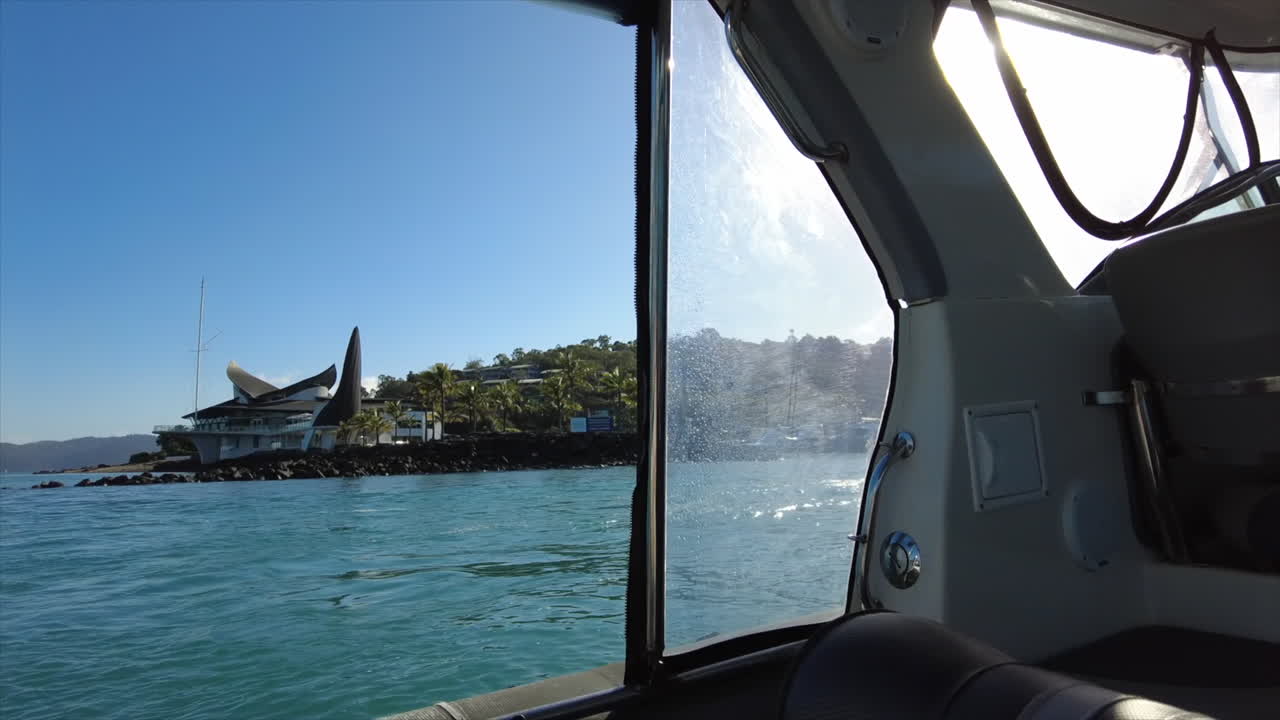 POV from a boat arriving into Hamilton Island Marina harbour, Whitsundays, Australia