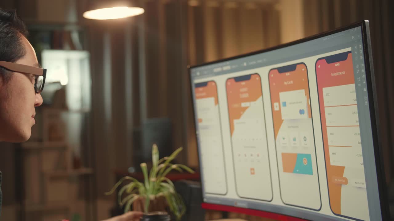 Asian Male Mobile Application Developer Works And Drinking Coffee With Graphics On His Personal Computer. He Works At Night