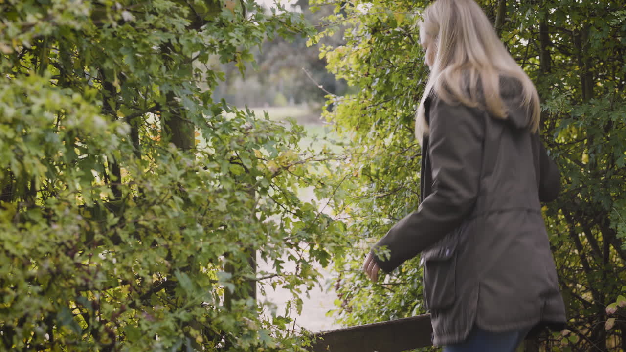 Woman in nature surrounded by trees
