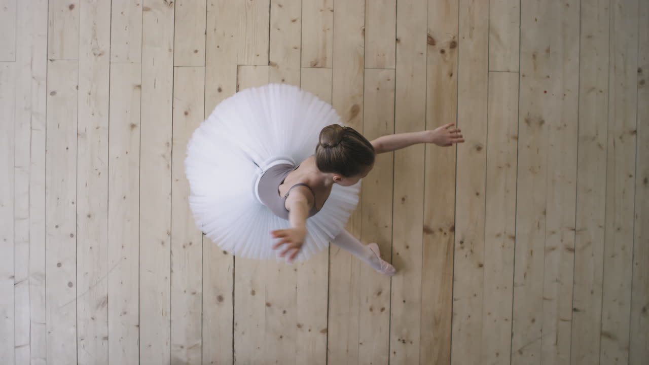 Top View Of Little Girl Performing Ballet Dance