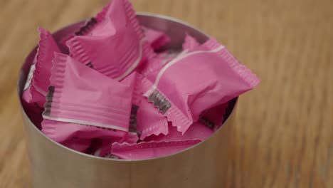 pink candy in a metal container