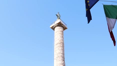 saint paul statue on top of the column of marcus aurelius in rome, italy