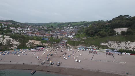 beer fishing village and beach devon england rising drone aerial view