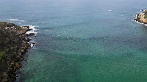 Panoramic-perspective-of-Carrizalillo's-furf,-sands-and-birdlife-at-Puerto-Escondido,-Oaxaca,-Mexico