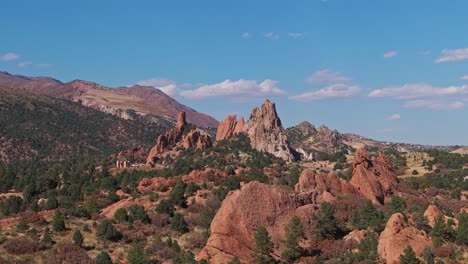 drone rises above hill to reveal stunning geologic structures of garden of the gods colorado