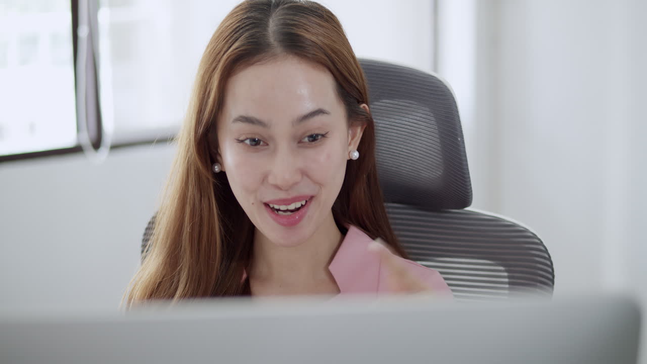 A joyful office celebration captures a team member's excitement over recent achievements.