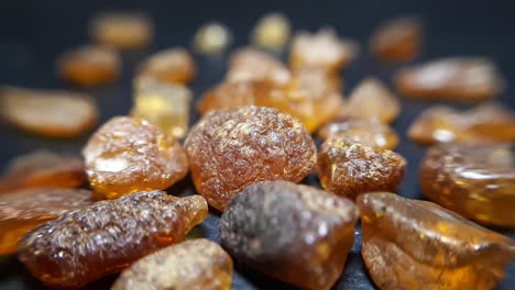 natural baltic amber stones on a black background-4