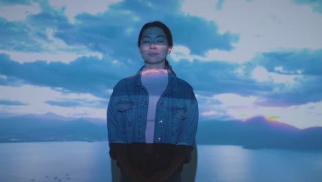 woman visiting immersive art exhibition with images of clouds being projected onto her face