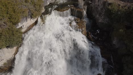 The-roaring-owen-sound-waterfall-surrounded-by-lush-greenery-in-ontario,-canada,-aerial-view