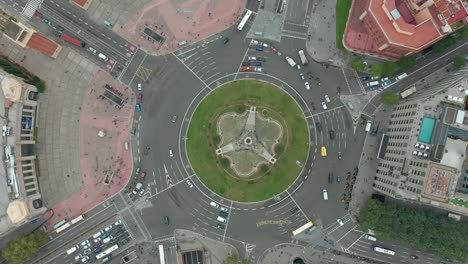 roundabout from above with vehicles circling around the traffic