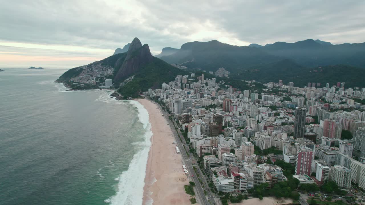 Bird's eye view on Leblon beach Rio de Janeiro dois irmaos hill epic cloudy sunset Brazil
