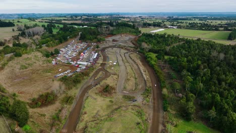 Aerial-Overhead-View-Motor-Race-On-Muddy-Racetrack-At-Frutillar,-Los-Lagos-Region,-Chile