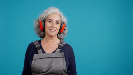 smiling senior woman in safety gear