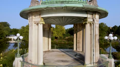 romantic setting at beautiful gazebo building in scenic nature river landscape - aerial drone establishing view