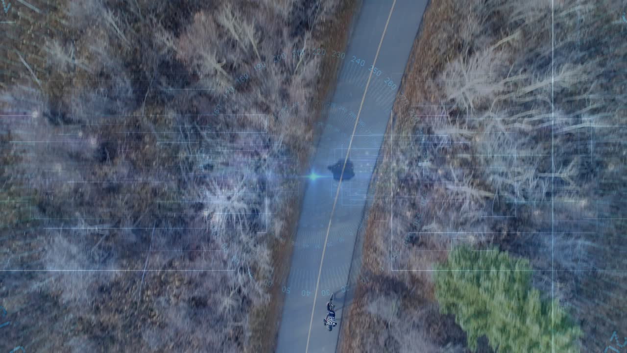 Drone tracking rider, teen riding bike on yellow centerline, grid flare tracing route for leisure