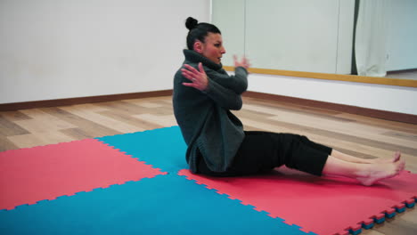 first physical warm-up exercises before dance on the blue and red tatami