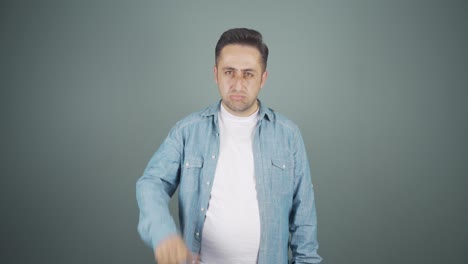 man looking at camera with a negative expression.