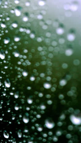 rain days, heavy rain falling on window surface vertical video