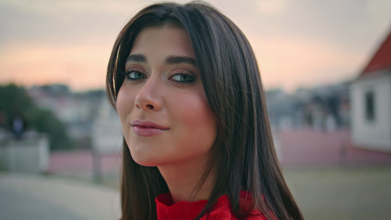 Tranquil woman enjoy evening sunlight sitting square alone closeup