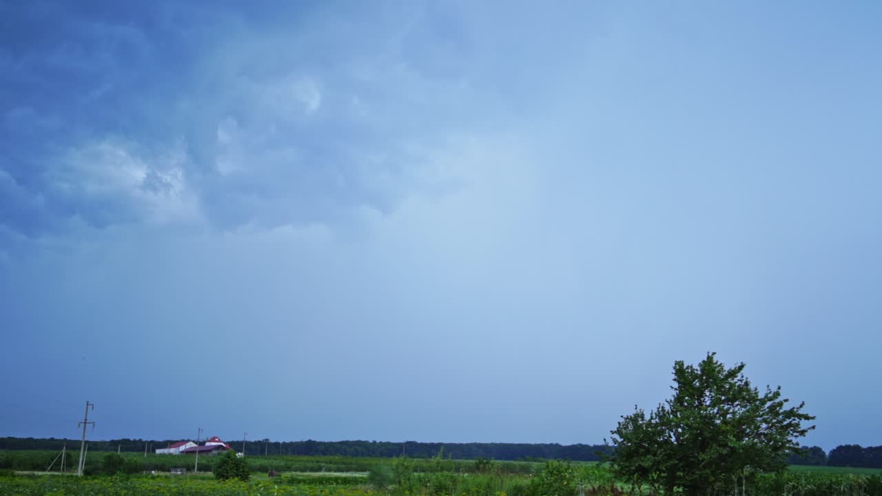 Set of beautiful lightning strikes on blue background. Small electrical lightnings in the sky over the green nature in the evening.