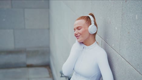 woman listening to music with headphones