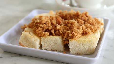 flossed pork bread on a plate ,