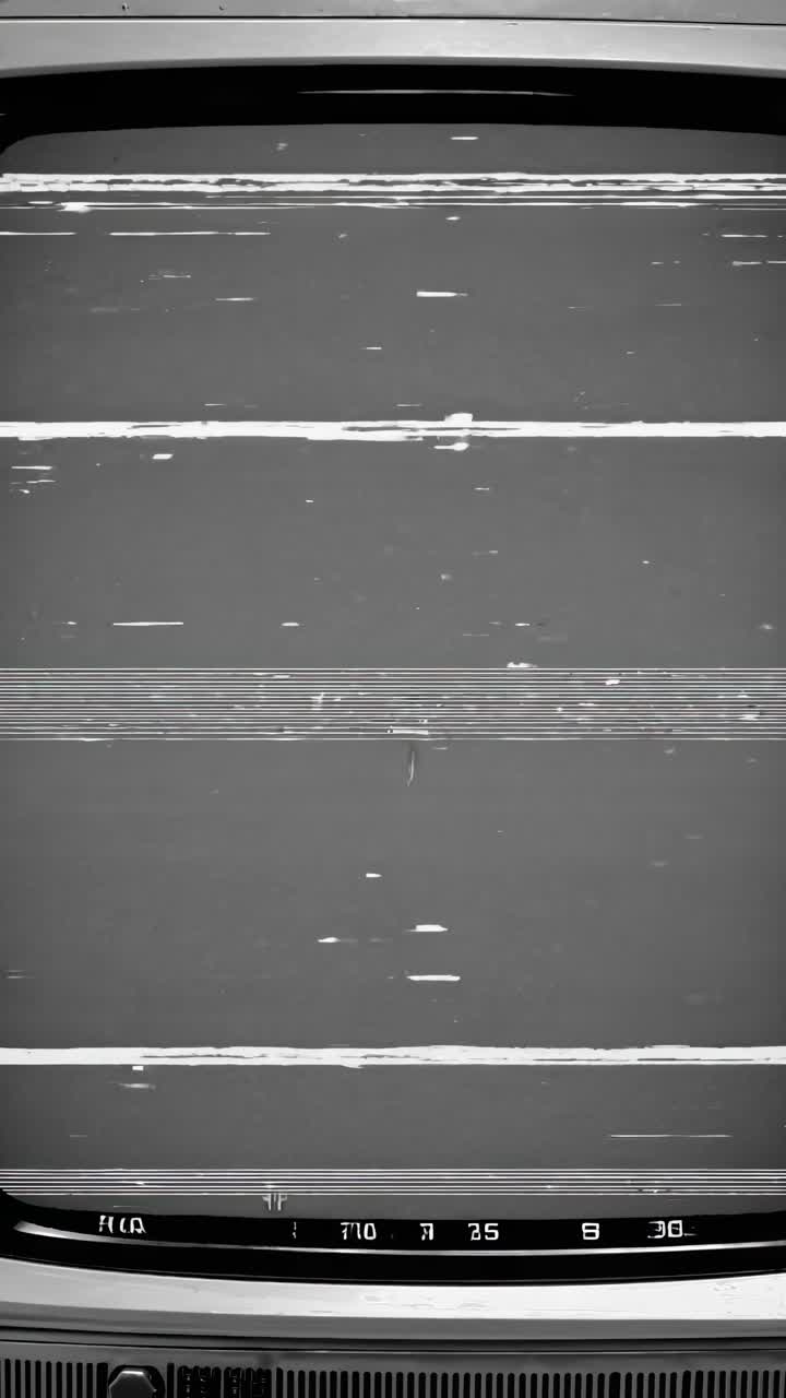 Close-up of a vintage TV screen with static noise, creating a retro video aesthetic
