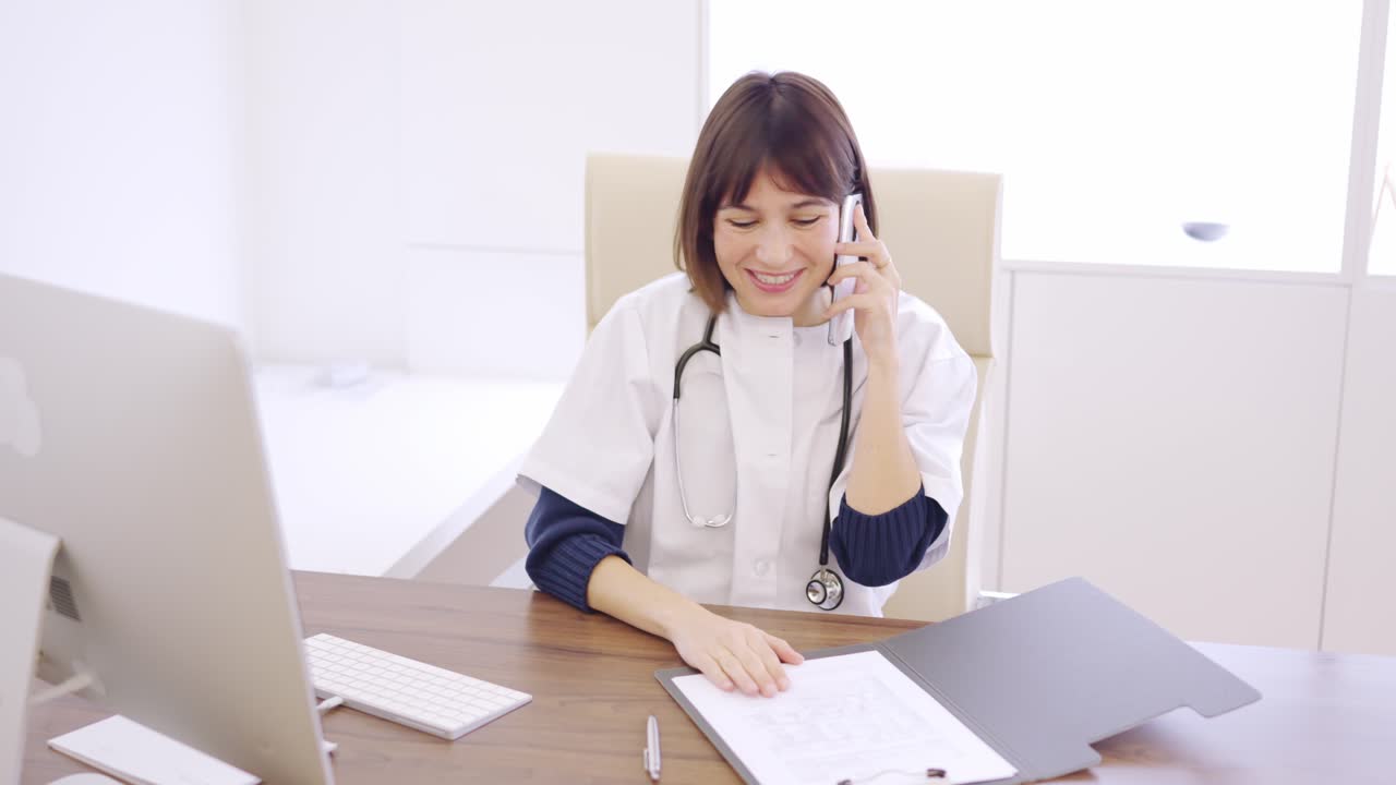 Female doctor communicating the good results of a medical test