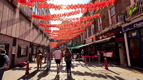 red lanterns hanging above a busy street