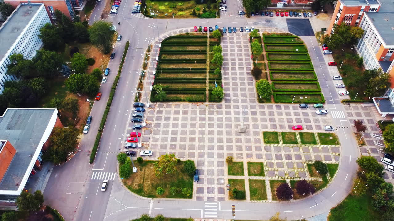 Aerial drone view of university campus among greenery and dwelling houses. Bucharest, Romania