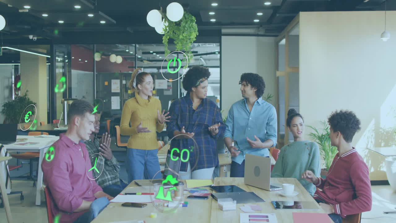 Animation of ecology icons over diverse colleagues discussing work in office